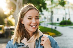 woman walking around outside smiling