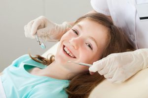 little girl at the dentist